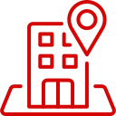 Red outline icon of a building with a location pin above it, placed on a map