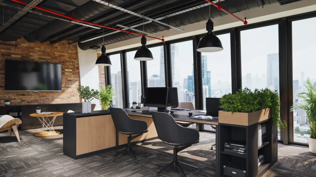 Modern office with large windows, black chairs, desks with computers, potted plants, exposed ceiling