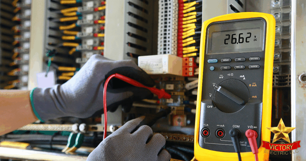 A gloved person uses a digital multimeter to measure voltage inside an electrical panel with